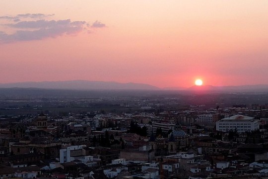 a view of a city at sunset