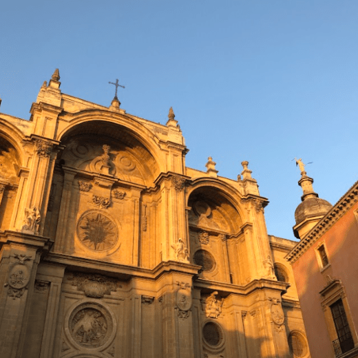 a church with a clock on the side of a building