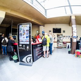 a group of people standing on a snow board