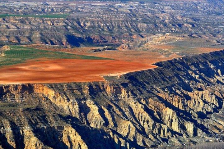 a canyon with a mountain in the background