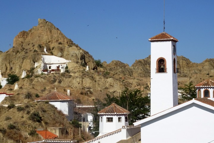 a church with a mountain in the background