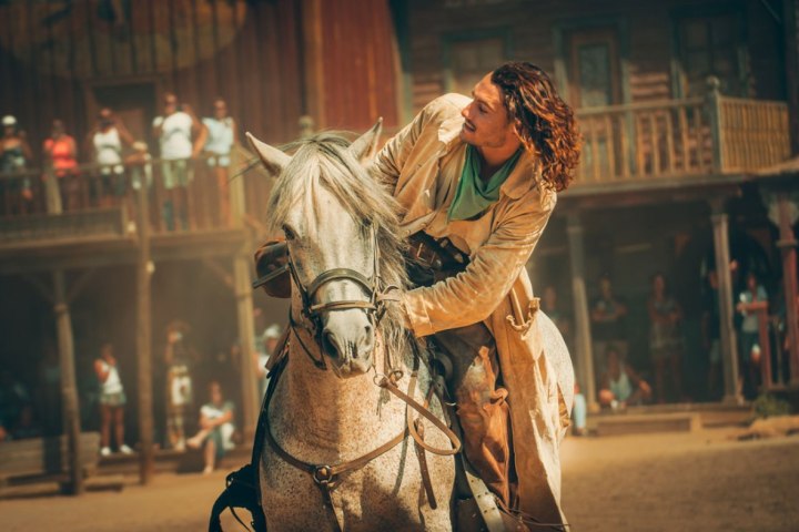 a statue of a person riding a horse