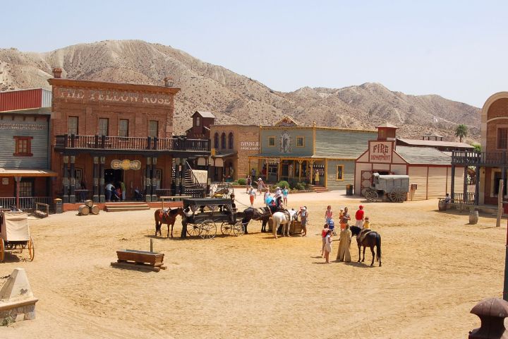 a group of people sitting in front of a building