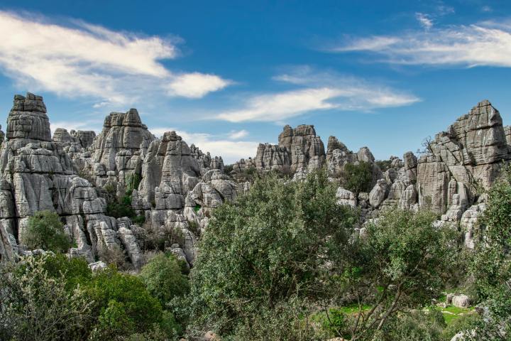a castle on a rocky hill with Custer State Park in the background