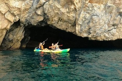 a cave that is swimming in the water